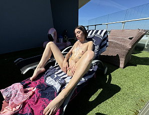 063025_yeva_naked_outdoors_on_rootop_terrace_masturbating_with_a_dildo
